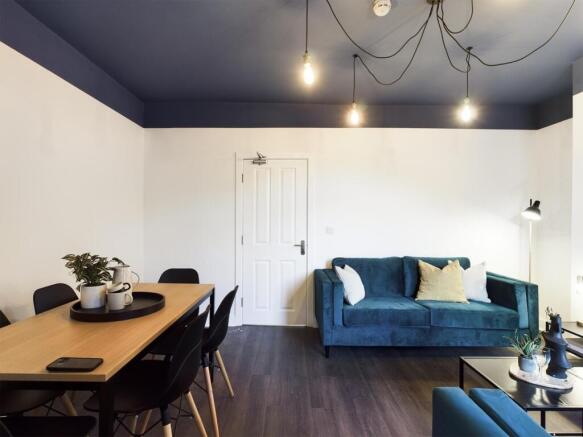 A spacious and stylish modern living room perfe...