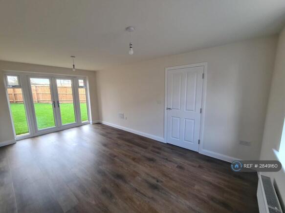 Lounge With Double French Doors Access To Garden