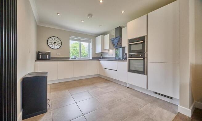 Open Plan L shaped living dining kitchen to rear