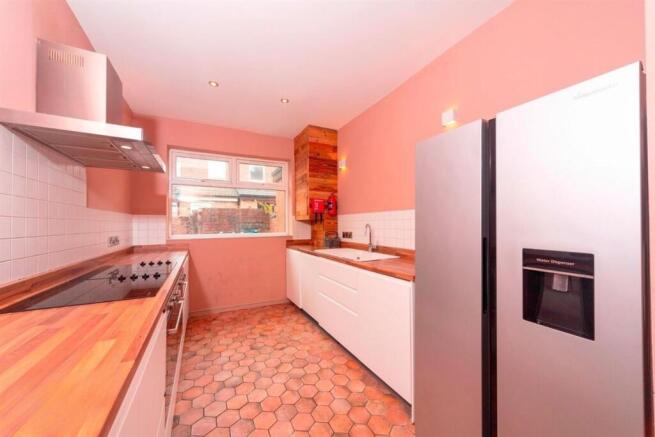 Bright galley kitchen with modern appliances...