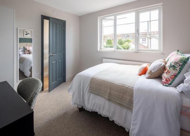 Bright and stylish bedroom with study space...