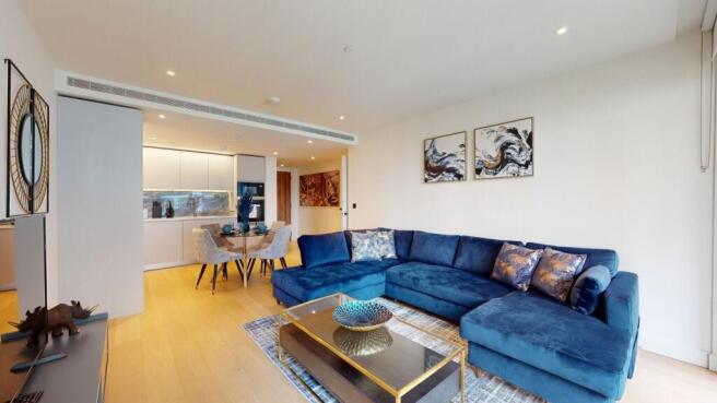 Bright lounge with stylish blue corner sofa...