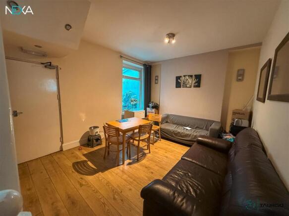 Social living area with ample seating and table...