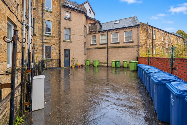 Rain-Glossed Residential Courtyard.png