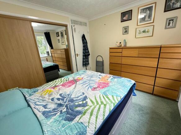 Bed 1 to wardrobe