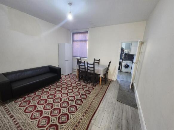 Bright shared living room with a large patterne...