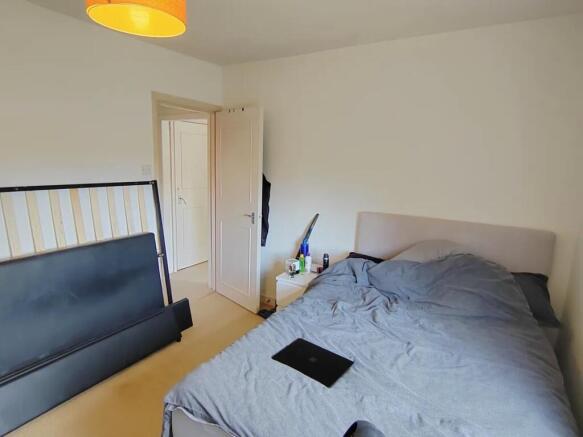 Bright, airy bedroom with a comfortable bed...
