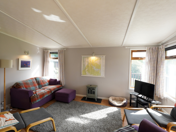 Spacious living room inside the holiday lodge