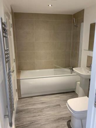 Modern bathroom with bath and shower...