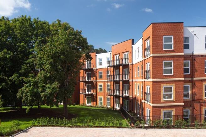 External of apartments with tree and green area at Cricket Field Grove