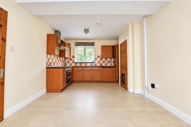 Bright Empty Open-Plan Kitchen Interior.png