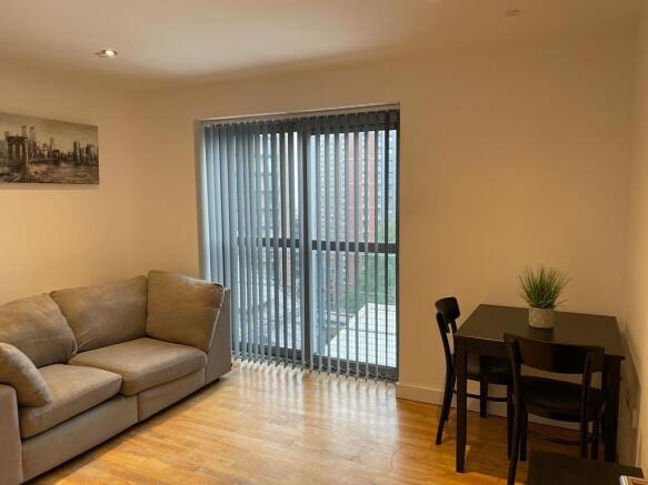 Bright modern lounge with comfy sofa and dining...