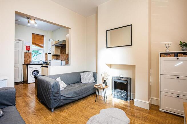 Bright open-plan lounge with wood flooring...