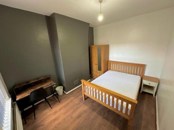 Bright furnished double bedroom with desk and b...
