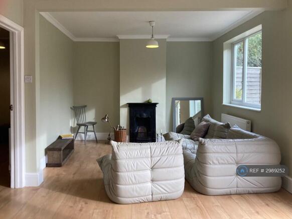 Open Plan Area With Ornamental Only Fireplace