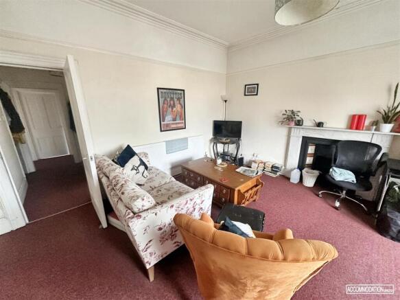 Bright and cozy lounge area with character....