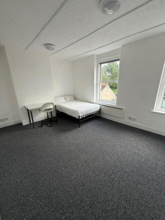 Bright and inviting double bedroom featuring am...