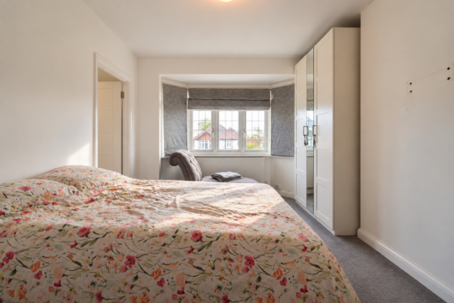 Bright Floral Bedroom by the Bay Window