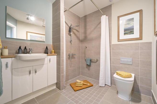 a bathroom with a shower and toilet