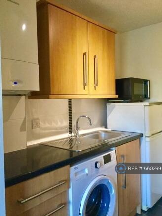 Modern Kitchen With New Washing Machine 
