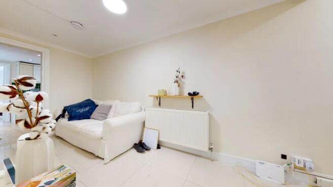 A cozy living room featuring a white sofa again...