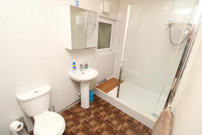 Bright bathroom with spacious walk-in shower...