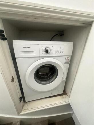 Convenient laundry area with modern appliances...