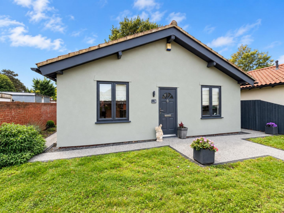 Sunny Grey Gabled Bungalow with Garden.png