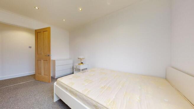 Bright modern bedroom with ample floor space...