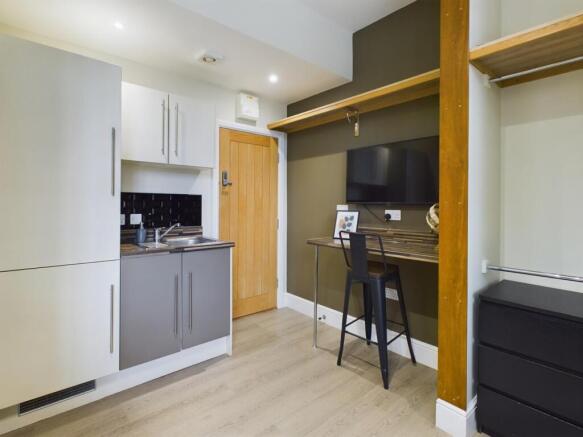 A modern kitchenette with a sleek design and am...