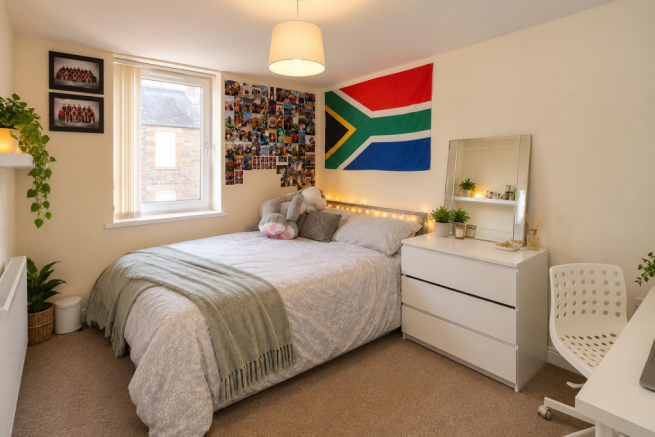 Cosy Bedroom with Plants and Memories.png