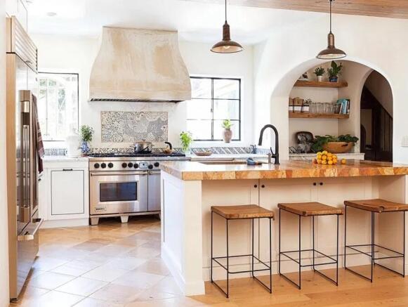 Bright and welcoming kitchen with modern applia...