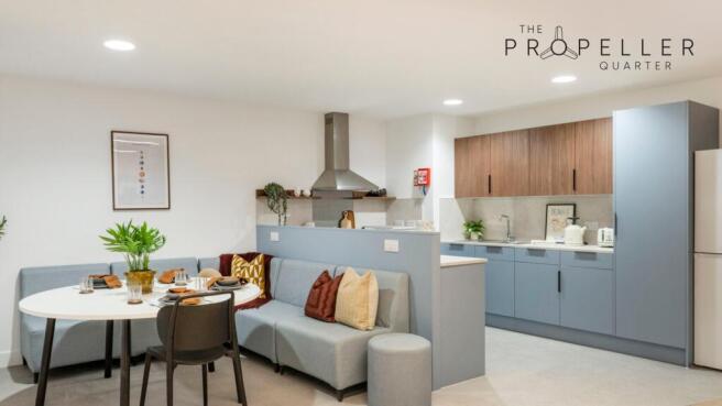 Bright, modern open-plan kitchen and dining are...