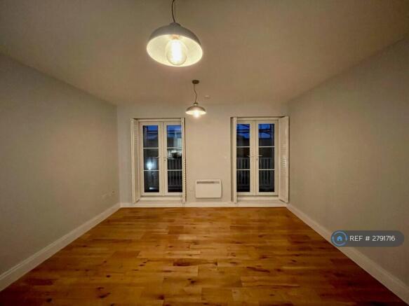 Open Plan Lounge With Balcony Doors