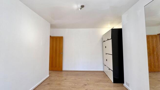 Bright and airy room with sleek modern storage...