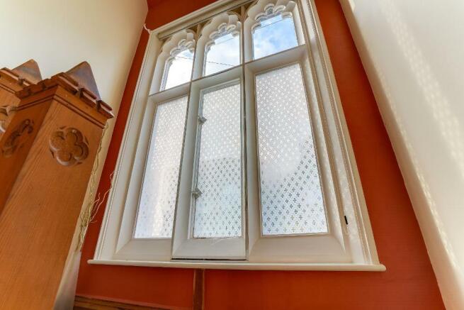 Grand window half way up the staircase