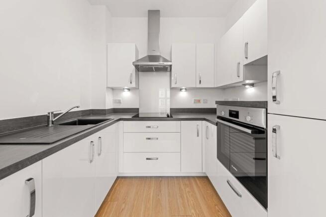 a kitchen with white cabinets