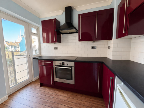Bright Burgundy Kitchen with City Views.png