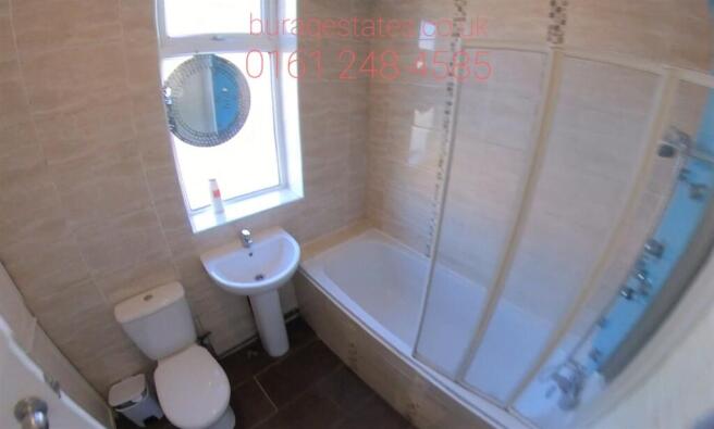 Bright, modern bathroom with a full bath and ov...