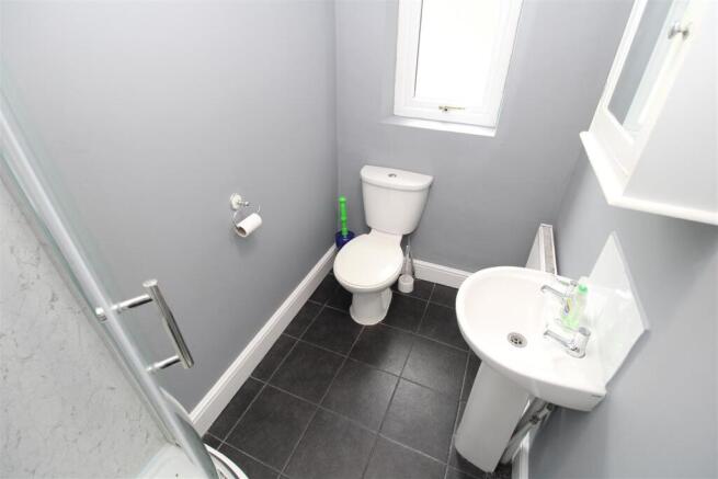 Bright, modern bathroom with sleek tiling...