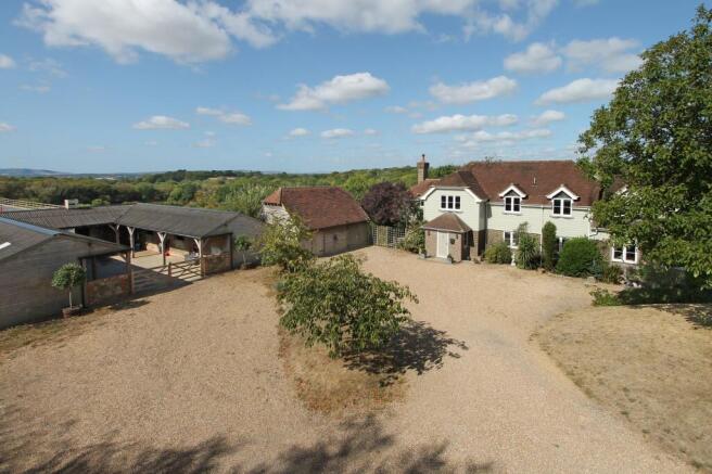 house, stables and view