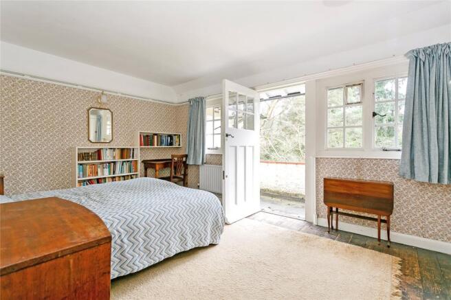 Bedroom With Balcony