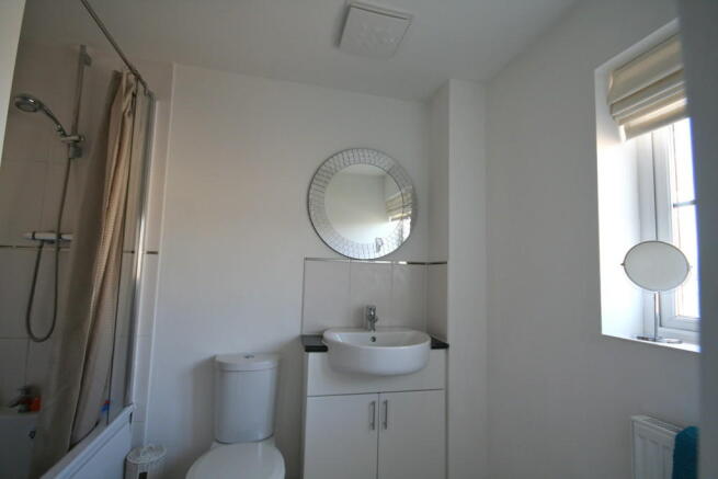 Master en-suite bathroom with shower over bath