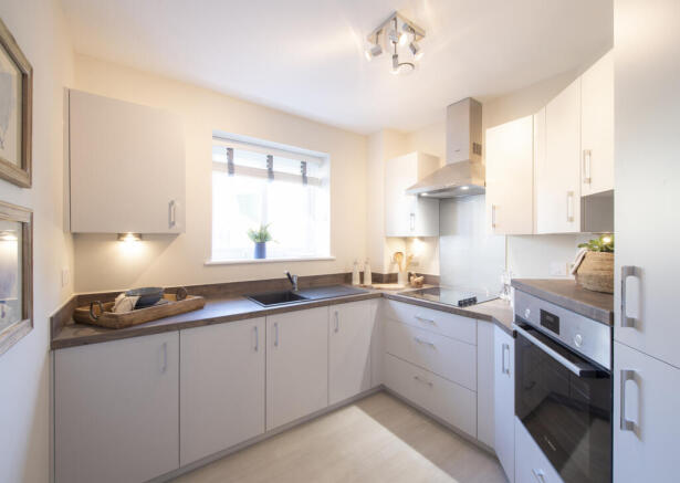 a kitchen with white cabinets