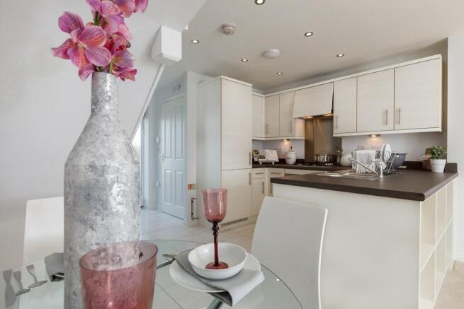 An open plan kitchen dining area is designed for sociable living