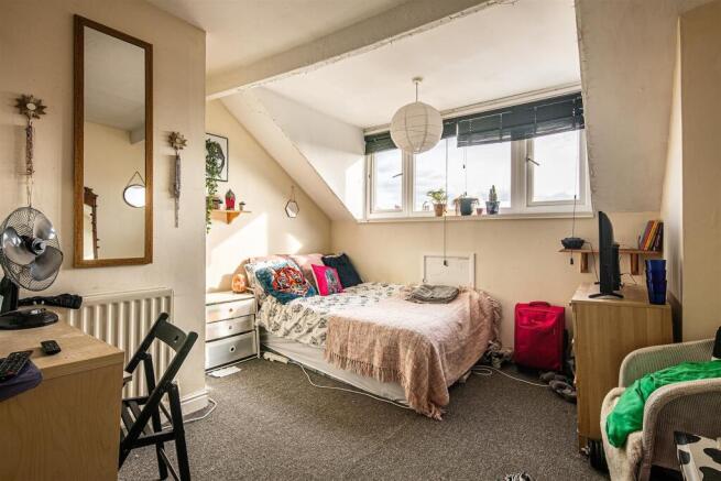 Bright and airy bedroom with large windows....