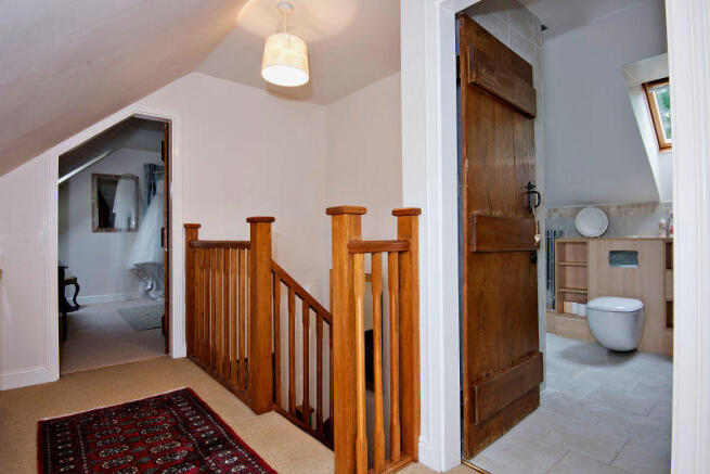 Landing leading to bedrooms 3 and 4, and family ba