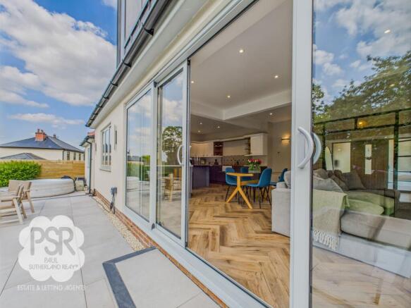 Large Sliding Doors to the Rear Patio for those Sunny Summer Days