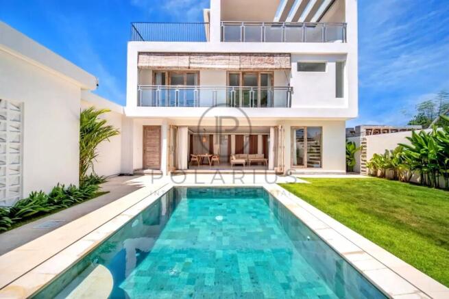 Modern villa with a pool, spacious balcony, and lu