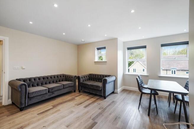 Bright lounge with plush sofas and dining area...